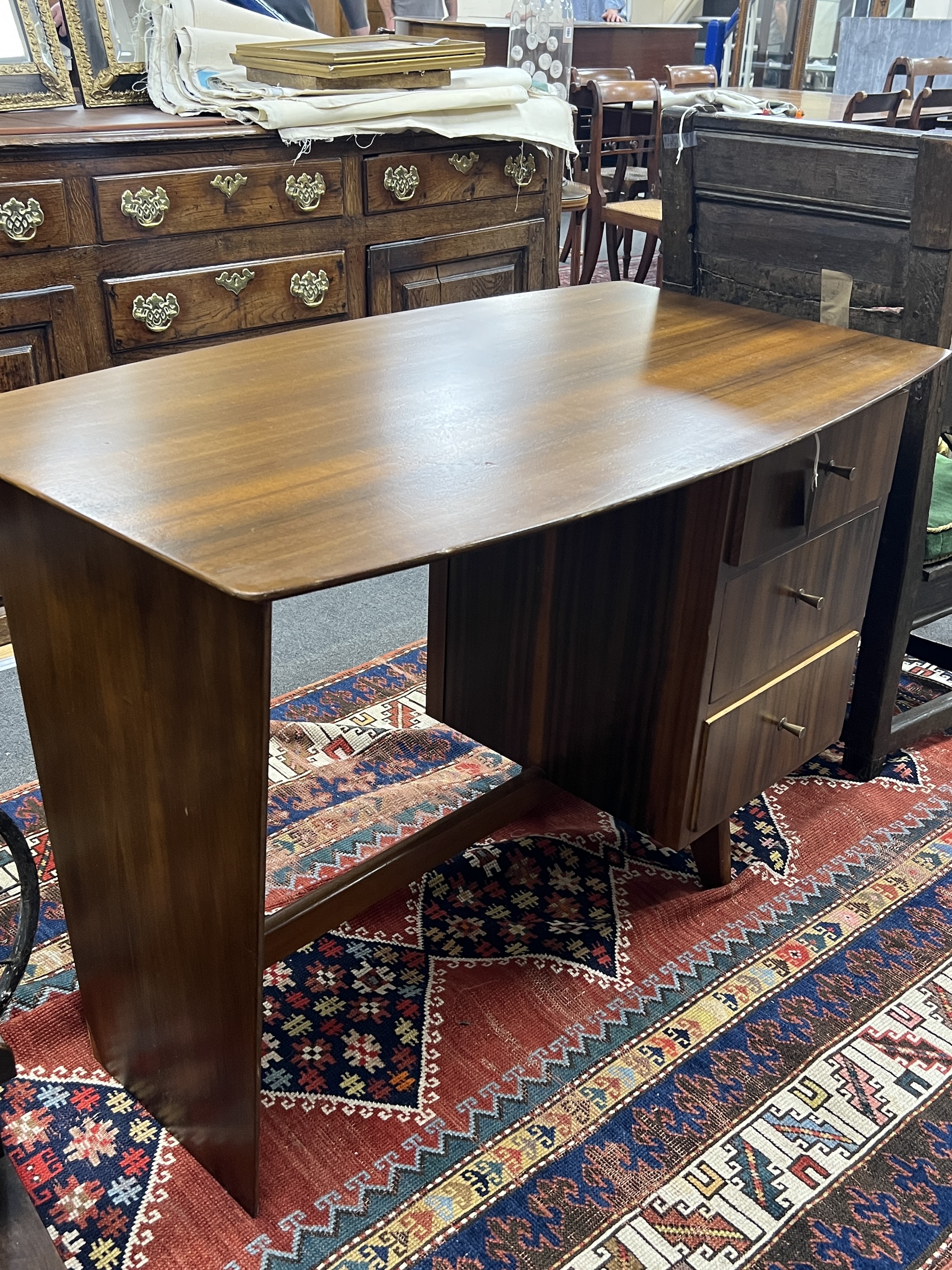 A mid century walnut desk, width 108cm, depth 64cm, height 75cm